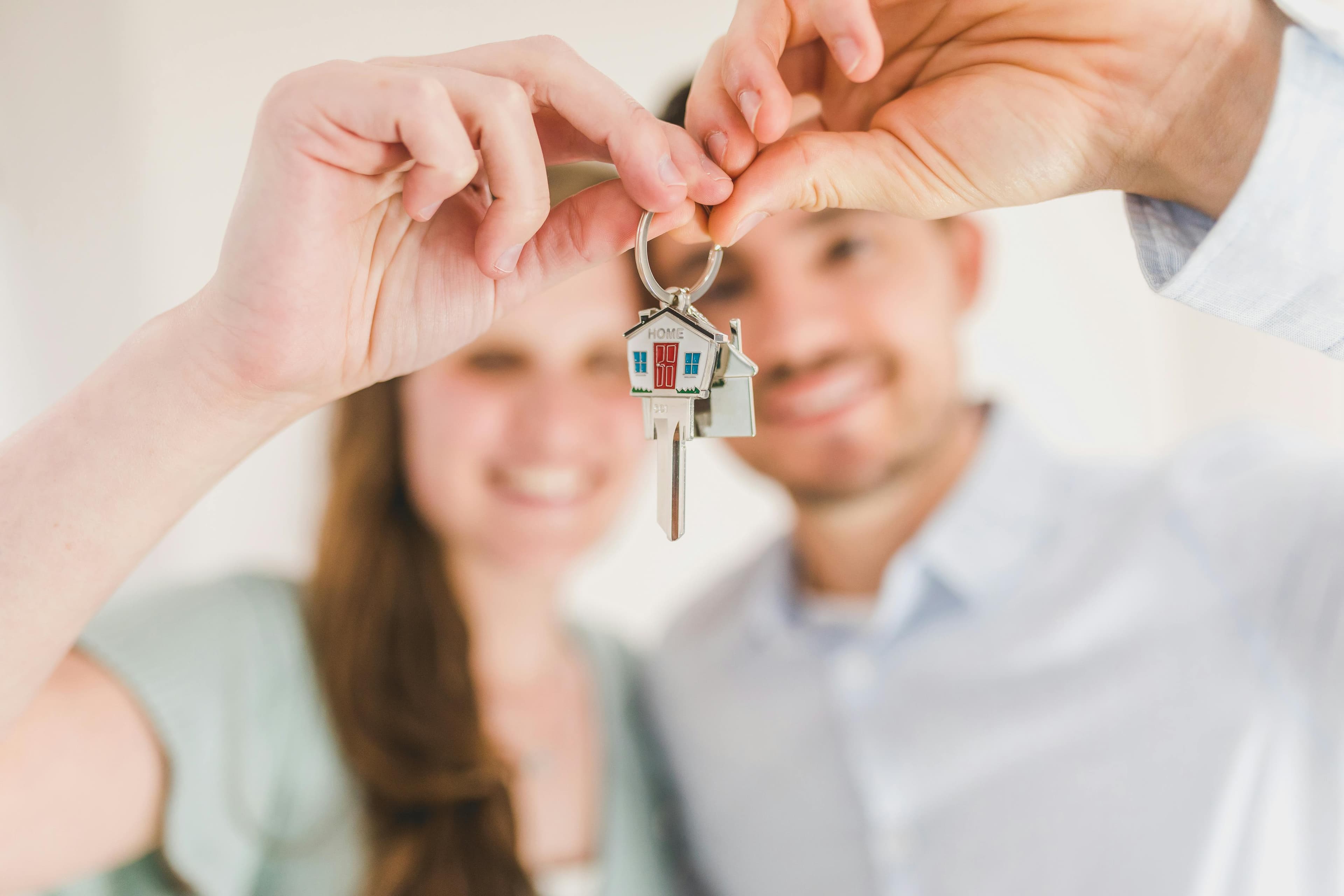 First-time homebuyers receiving keys to their new home